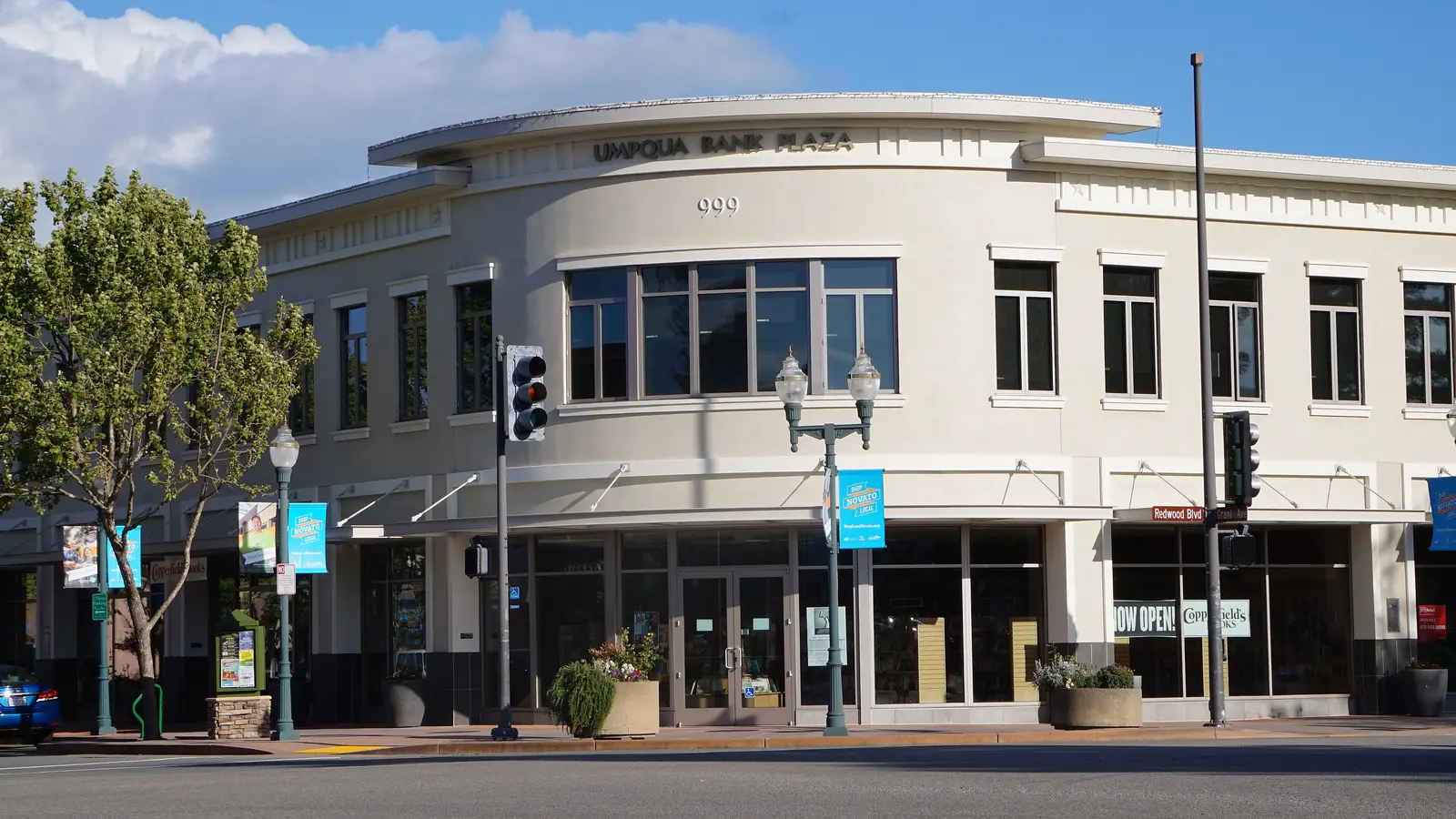 The Umpqua Bank Plaza building on a street corner in downtown Novato