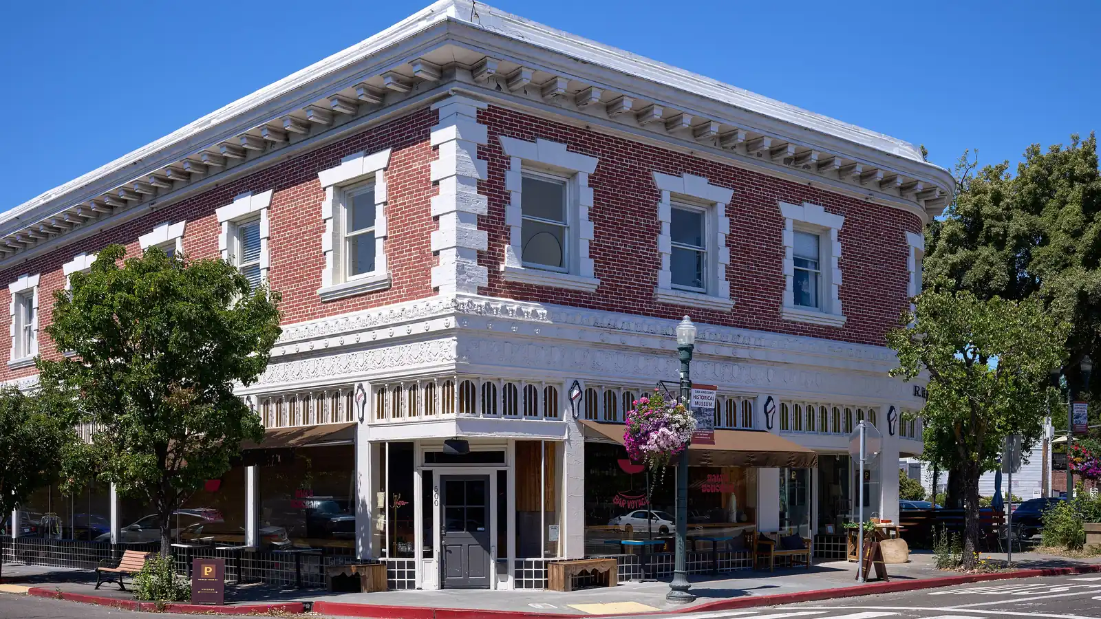 The historic brick R. H. Cheda Building on a corner in downtown San Anselmo